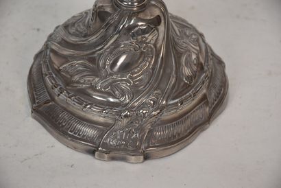 A pair of silver plated bronze torches in...