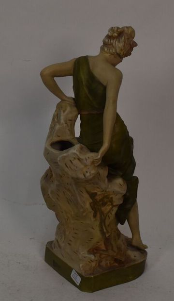 Polychrome ceramic vase with female figure

Royal...
