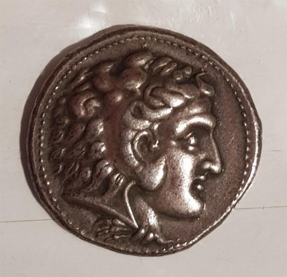 Silver coin showing a man in profile 

16,70...