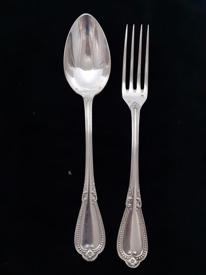 Twelve pieces of silver flatware with pearls...