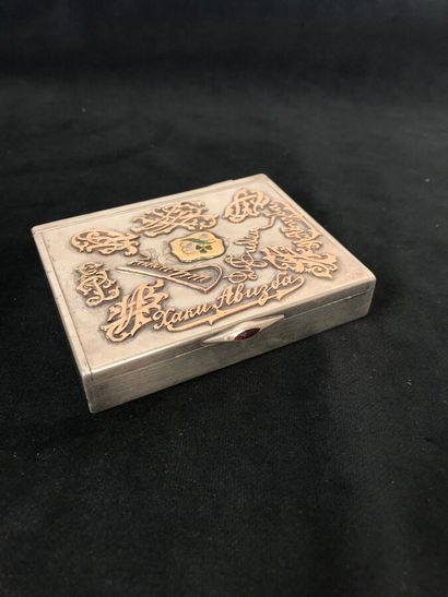 A silver cigarette box with signature dcor,...