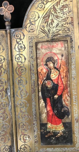 Triptych, travel icon in bronze opening on...