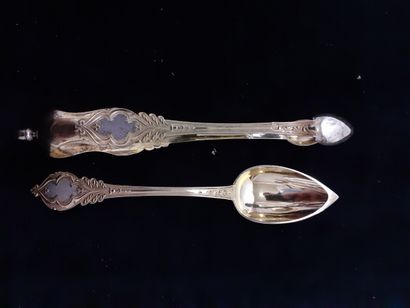 Twelve vermeil tea spoons and sugar tongs...