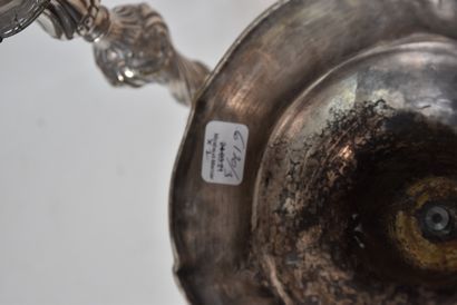 A pair of silver plated bronze torches in...