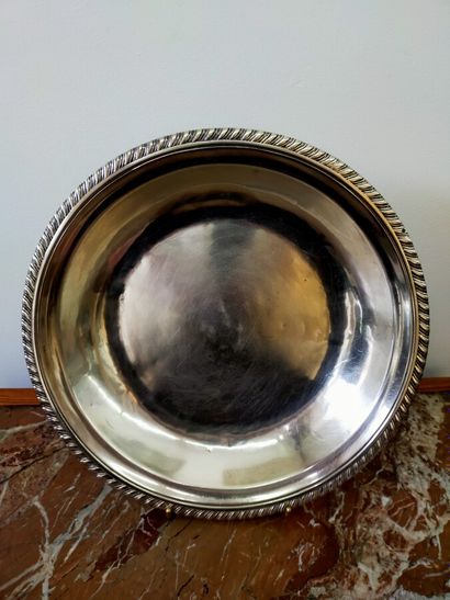 Three silver dishes: one round, two oval...
