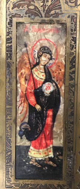 Triptych, travel icon in bronze opening on...