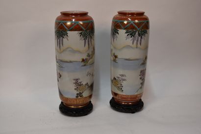 Pair of porcelain flanged vases decorated...