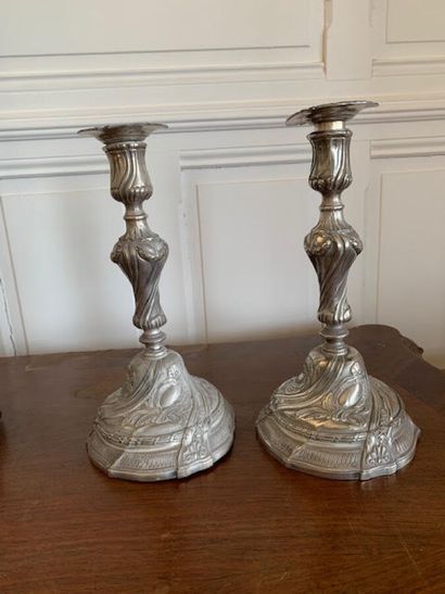A pair of silver plated bronze torches in...