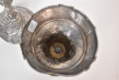 A pair of silver plated bronze torches in...