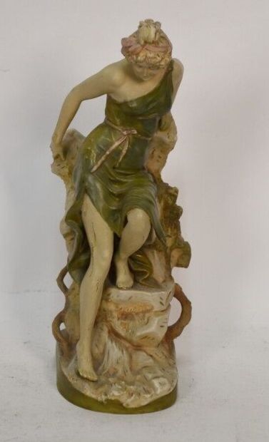 Polychrome ceramic vase with female figure

Royal...