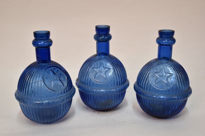 Set of three US blue glass bottles, for fire...