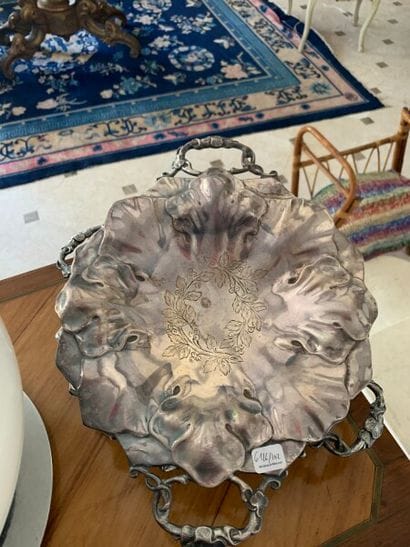 Pair of silver plated cups with foliage design...