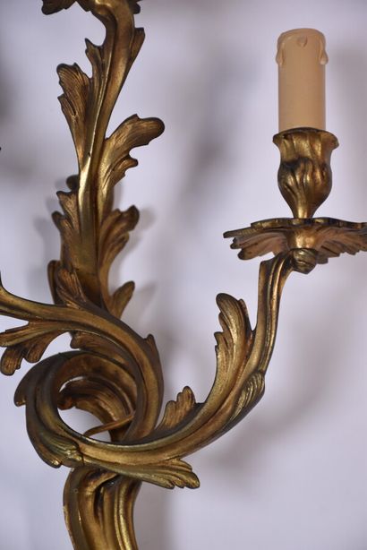 Two pairs of rocaille sconces in chased and...