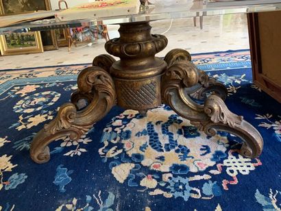 Coffee table, the glass top resting on a...