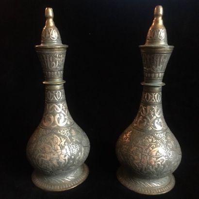A pair of bronze prophylactic flasks, the...