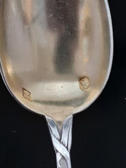 Twelve silver and vermeil coffee spoons with...