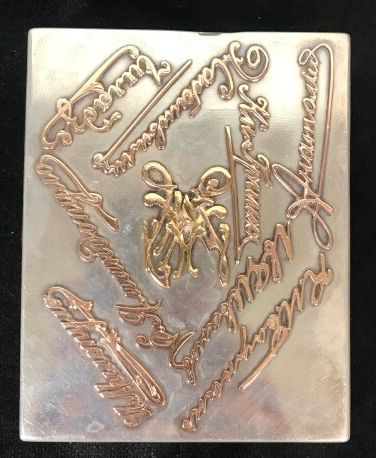 A silver cigarette box with signature dcor,...