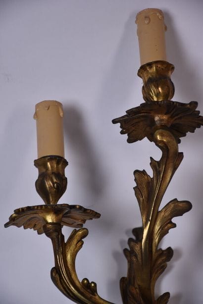 Two pairs of rocaille sconces in chased and...