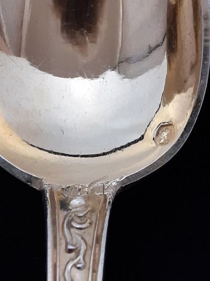 Twelve vermeil tea spoons and sugar tongs...