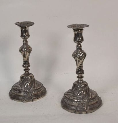 A pair of silver plated bronze torches in...