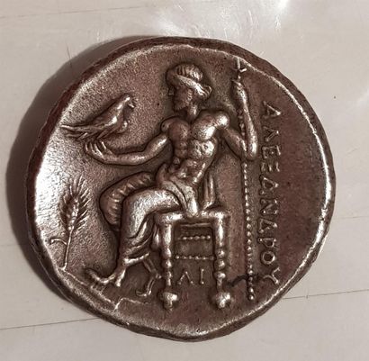 Silver coin showing a man in profile 

16,70...