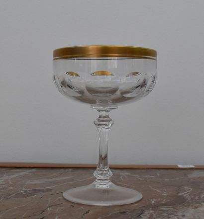 Six crystal glasses with gilded border decoration

H....