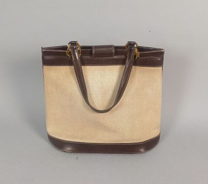 HERMES Paris

Sac en toile beige et cuir...