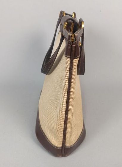 HERMES Paris

Sac en toile beige et cuir...