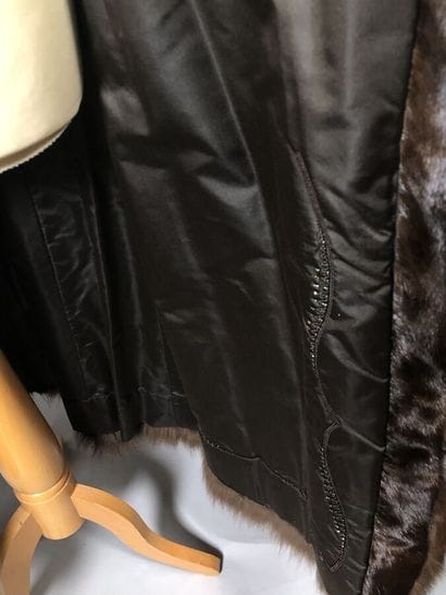 HENRI STERN, 8 av. Matignon, Paris

Manteau...