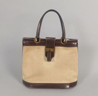 HERMES Paris

Sac en toile beige et cuir...