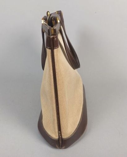 HERMES Paris

Sac en toile beige et cuir...