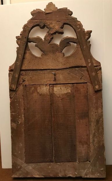 Wood and gilded paste mirror with parecloses,...