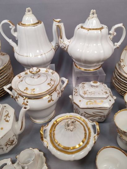 Part of service in white porcelain with gold...