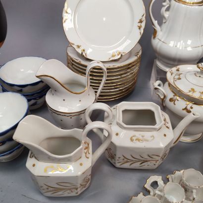 Part of service in white porcelain with gold...