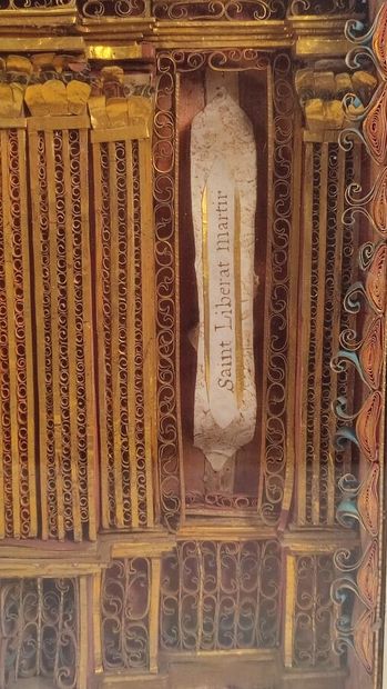 Reliquary frame with paperoles representing...