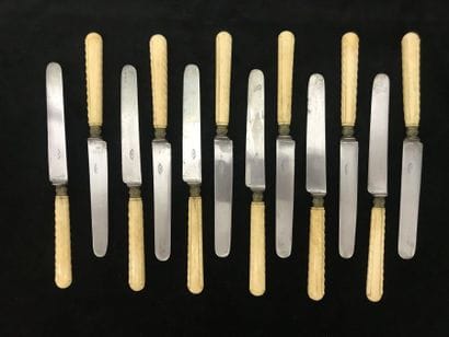 Twelve cheese knives, ivory handle, steel...