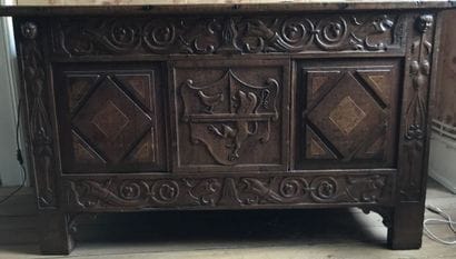 Carved oak chest
Seal and coat of arms in...