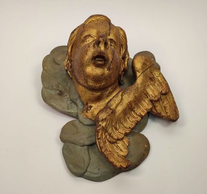 Putto in gilded wood and green lacquered...