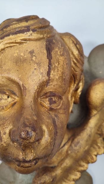 Putto in gilded wood and green lacquered...