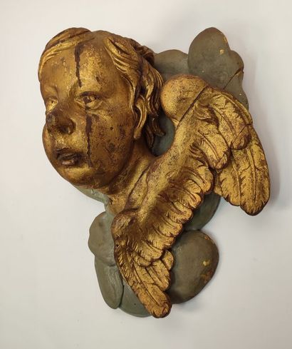 Putto in gilded wood and green lacquered...