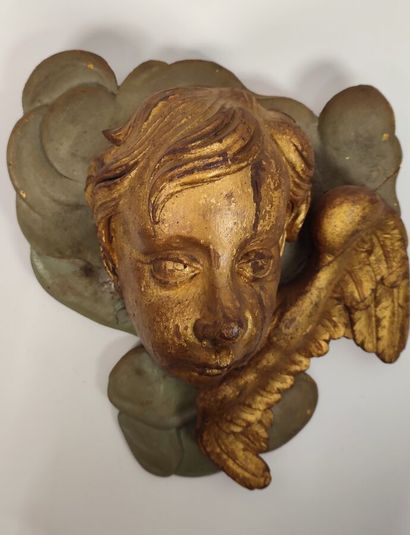 Putto in gilded wood and green lacquered...