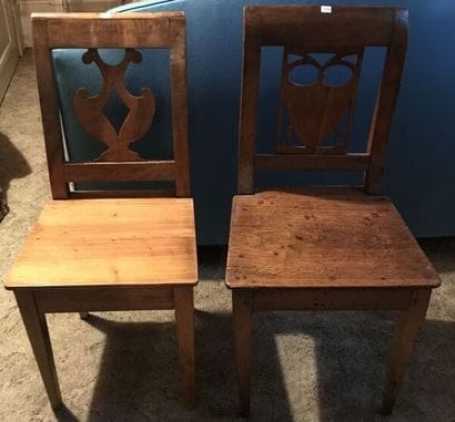 Two mismatched chairs with cut out backrest...