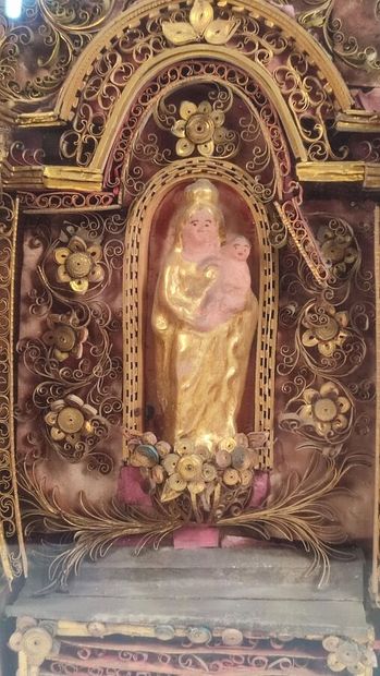 Reliquary frame with paperoles representing...