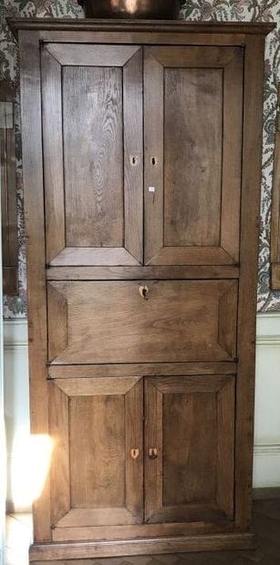 One-leaf secretary in oak cupboard opening...