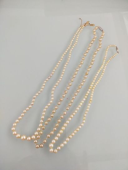 Two pearl necklaces and a fancy necklace