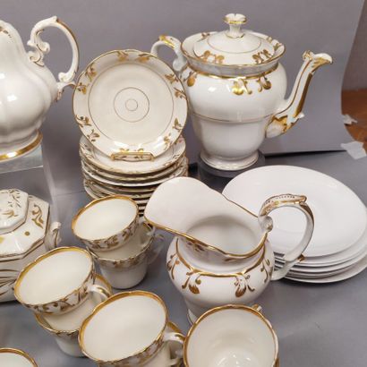 Part of service in white porcelain with gold...