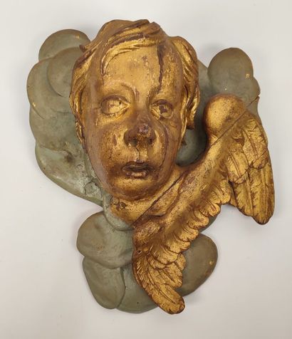 Putto in gilded wood and green lacquered...