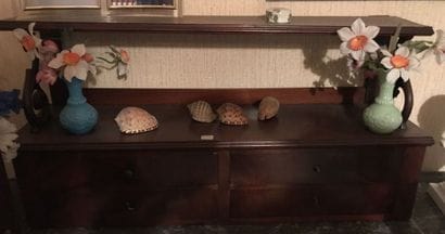 Mahogany desk shelf
On a shelf, opening to...