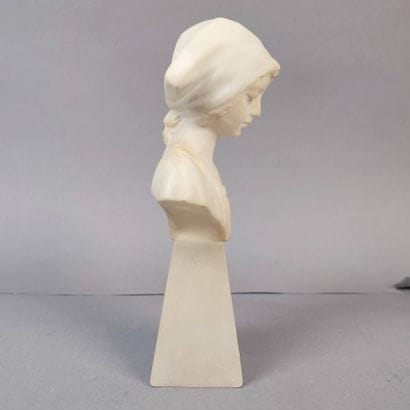 Statuette of a young girl with a white marble...