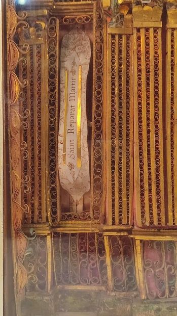 Reliquary frame with paperoles representing...